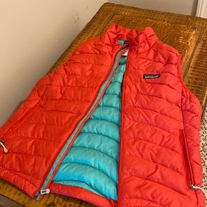 Fabulous quilted orange/aqua lined Patagonia vest.Zipper pickets inside and out.